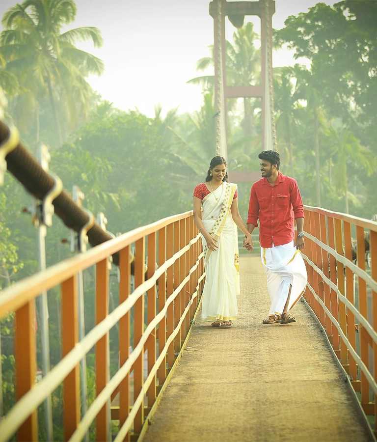 Kerala Lovers Paradise - couple walking on a bridge in Kerala