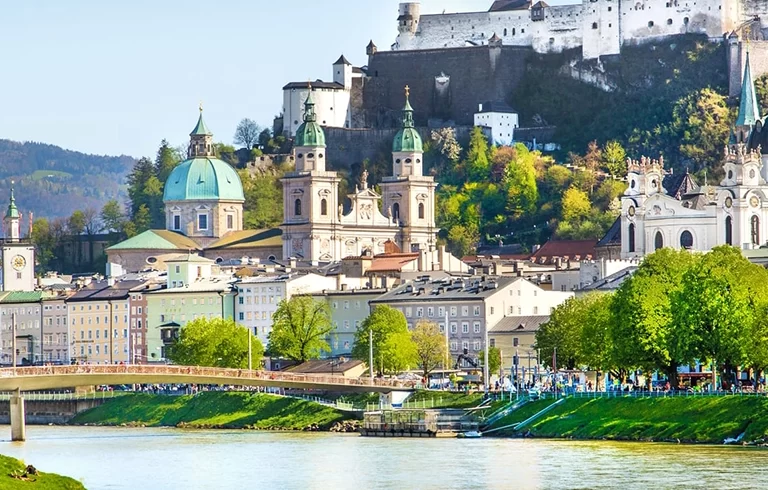 Beautiful view of Salzburg skyline with Festung Hohensalzburg and Salzach river in summer, Salzburg, Salzburger Land, Austria.