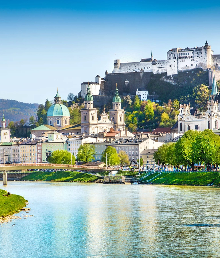 Beautiful view of Salzburg skyline with Festung Hohensalzburg and Salzach river in summer, Salzburg, Salzburger Land, Austria.