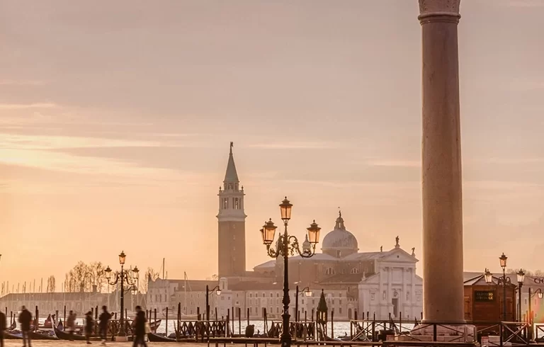 Venice is a city in northeastern Italy and the capital of the Veneto region. It is situated across a group of 118 small islands that are separated by canals.