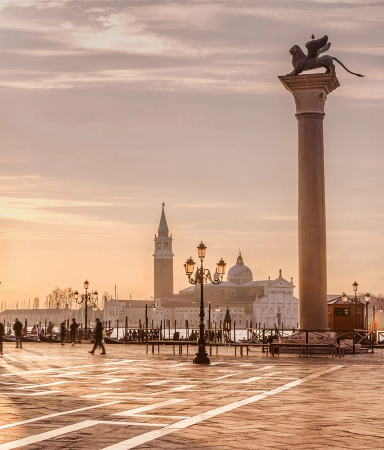 Venice is a city in northeastern Italy and the capital of the Veneto region. It is situated across a group of 118 small islands that are separated by canals.